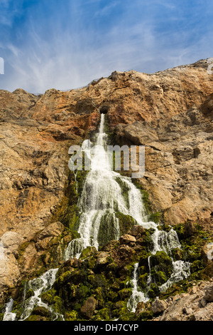 A LARGE WATERFALL FROM THE ROCK FACE IN GIBRALTAR AN OUTFLOW FROM THE DESALINATION PLANT ON THE TOP OF THE CLIFFS Stock Photo