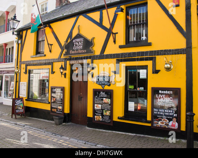 Tenby a seaside town on the Pembrokeshire Coast in Wales UK  The Coach and Horses Pub Thai Restaurant Stock Photo