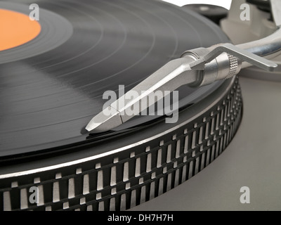 record playing on turntable and cartridge in front view Stock Photo