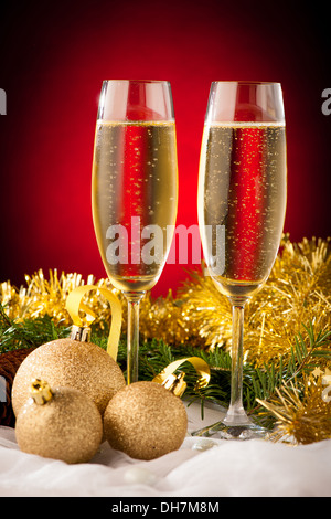 Two glasses of sparkling wine on christmas and new year decoration arrangement background Stock Photo