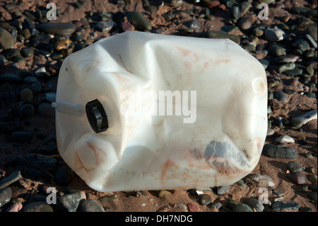 Plastic bottle washed up on beach ocean pollution Stock Photo