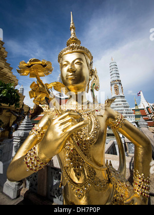 Golden Kinnari statue in Bangkok's Grand Palace complex, Thailand. Stock Photo