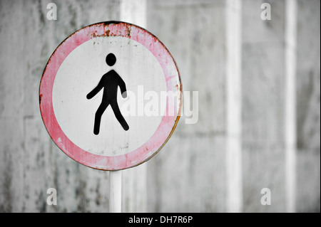 Old and rusty pedestrian prohibited road sign Stock Photo