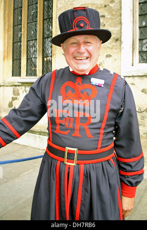Smiling and happy Beefeater guard in the Tower of London . Stock Photo