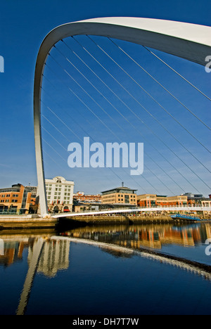 Gateshead Millenium bridge and perfect reflections in the River Tyne, Newcastle / Gateshead quayside. Stock Photo