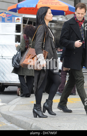 Lucy Liu and Jonny Lee Miller on set of new CBS series 'Elementary' in lower Manhattan New York City USA - 20.03.12 Stock Photo