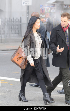 Lucy Liu and Jonny Lee Miller on set of new CBS series 'Elementary' in lower Manhattan New York City USA - 20.03.12 Stock Photo