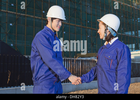Business people shaking hands at the site Stock Photo