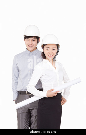 Business people wearing helmets Stock Photo