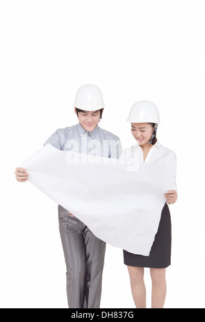 Business people wearing helmets Stock Photo