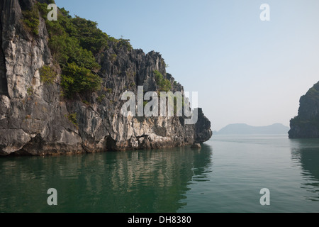 Spectacular limestone karst formations in Lan Ha Bay, Ha Long Bay, Vietnam. Stock Photo