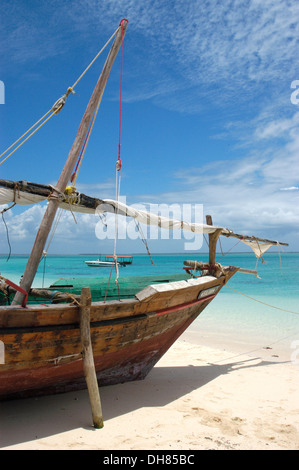 Dhow, a traditional sailing vessel, on the beach at low tide, Kendwa Rocks, North coast, Zanzibar, Tanzania Stock Photo