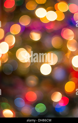 Colorful defocused christmass tree lights background Stock Photo