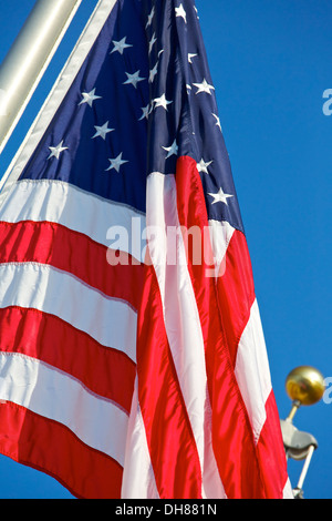 Stars and Stripes hang motionless shortly after dawn. Stock Photo