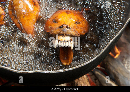 Slaughtered and dissected dogs being fried in hot oil, Siem Reap, Siem Reap, Siem Reap Province, Cambodia Stock Photo