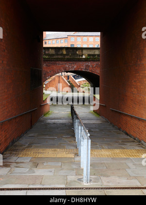 Walking under Chester Road into Castlefield Manchester UK Stock Photo