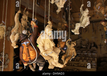 Woodcarving figures of wooden alpine mountaineers sold as souvenirs in souvenir shop of woodcutter, Tyrol, Alps, Austria Stock Photo