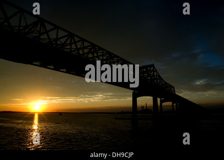 Sunset behind the Charles Braga Bridge over the Taunton River between Fall River and Somerset, Massachusetts, USA. Stock Photo