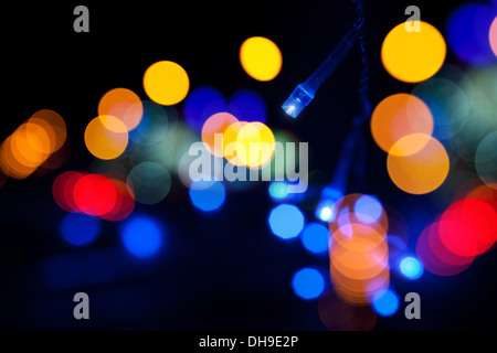 Colorful LED (light emitting diodes) lights garland with bokeh effect on black background Stock Photo