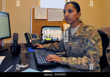 Capt. Dimple Nolly, 455th Air Expeditionary Wing deputy staff judge advocate, deployed from Spangdahlem Air Base, Germany, and a Houston native, works in her office at Bagram Air Field, Afghanistan, Oct. 29, 2013. Stock Photo