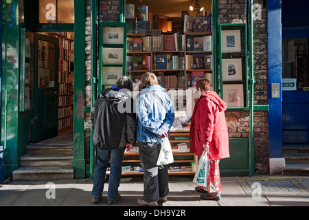 People looking in book shop window of Antiquarian independent antique bookshop store bookstore York North Yorkshire England UK United Kingdom Britain Stock Photo
