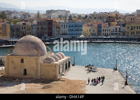 A view of Kioutsouk Hasan mosque and Chania harbour, Crete, Greece. Stock Photo