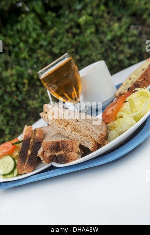 Brown crab sandwich salad with Guernsey Gâche at the beach kiosk at Portelet harbour, Guernsey, Channel Islands. Stock Photo