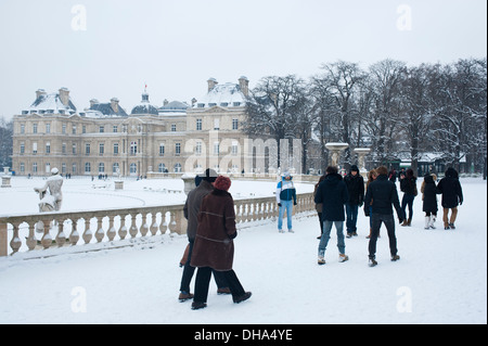 Paris, France - People walking at Parc de Luxembourg on a winter snow day Stock Photo