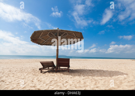 chairs umbrella on beach Stock Photo