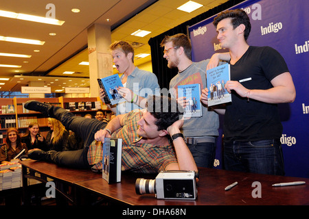 Ben Nemtin Duncan Penn Jonnie Penn and Dave Lingwood cast members of Buried Life appear at Indigo Bookstore promoting new book Stock Photo