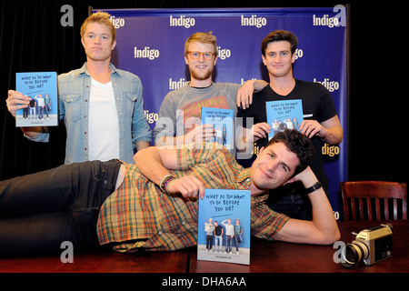 Ben Nemtin Duncan Penn Jonnie Penn and Dave Lingwood cast members of Buried Life appear at Indigo Bookstore promoting new book Stock Photo