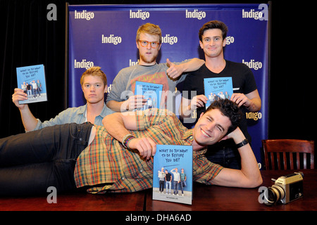 Ben Nemtin Duncan Penn Jonnie Penn and Dave Lingwood cast members of Buried Life appear at Indigo Bookstore promoting new book Stock Photo