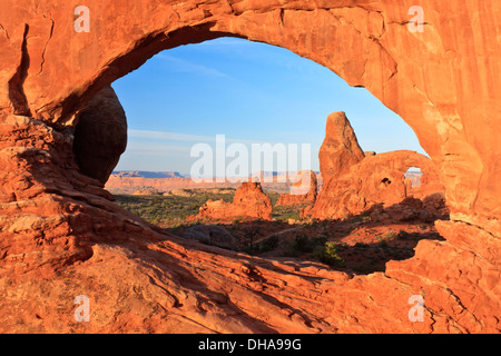Turret Arch seen through the eye-shaped North Window at Arches National Park, Utah Stock Photo