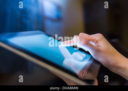 hand presses on screen digital tablet Stock Photo