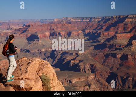 Hiker at Ooh-ahh Point on the South Kaibab Trail, Grand Canyon National Park, Arizona. (Model Released) Stock Photo