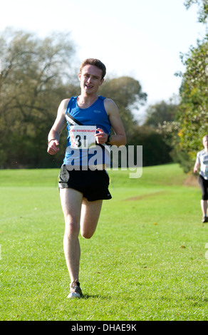 A male student running in the Brose Cross Country Relays at Warwick University, UK Stock Photo