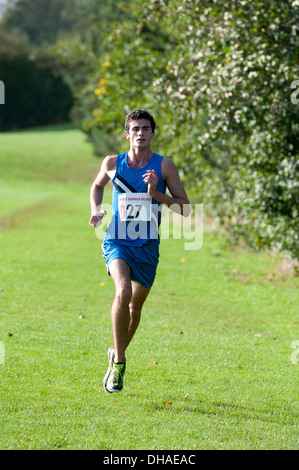 A male student running in the Brose Cross Country Relays at Warwick University, UK Stock Photo