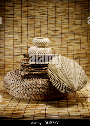 Chinese traditional bamboo mat, fan and cushion with floral pattern Stock Photo
