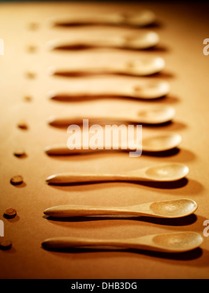 Wood spoons in a row Stock Photo