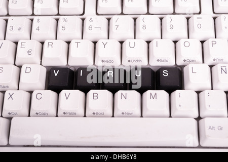 Word Virus written with black keys on computer keyboard. Stock Photo