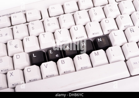 Word Learn written with black keys on computer keyboard. Stock Photo