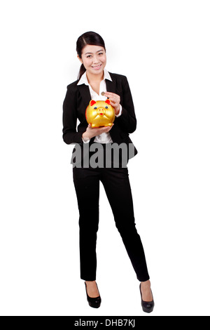 Businesswoman holding a piggy bank Stock Photo