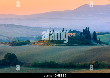 Famous Podere Belvedere in morning light, in the heart of the Tuscany, near San Quirico in de Val d'Orcia valley Stock Photo