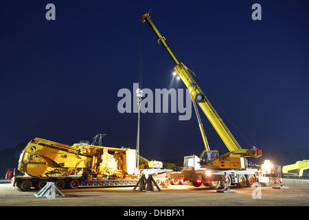 Mining in Africa. Night crane lift Stock Photo