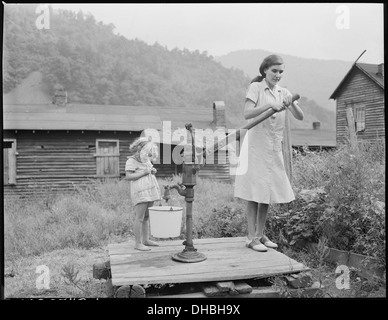 Bobbie Jean Sergent, 4, goes with Lucy, 26, who is blind, to get water. P V & K Coal Company, Clover Gap Mine... 541302 Stock Photo