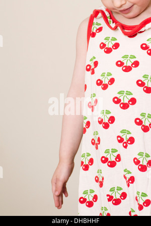 Portrait of little girl in dress with cherries Stock Photo