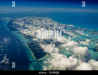 Aerial view of Caribbean islands dotted by bright white cloud cover shading visitors Stock Photo