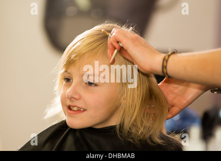 hair care - little girl at a hairdressing salon Stock Photo