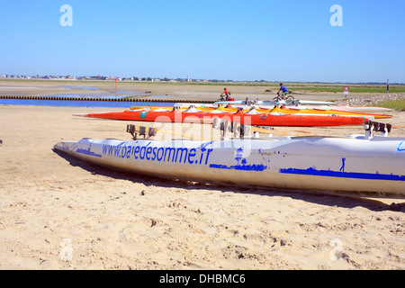 Canoes and kayakes on beach at Baie de la Somme, Quai Jeanne d'Arc, St Valery Sur Somme, Somme, Picardy, France Stock Photo