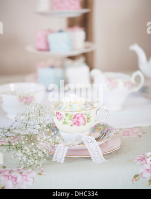 A table laid for tea, with floral china tea service Stock Photo